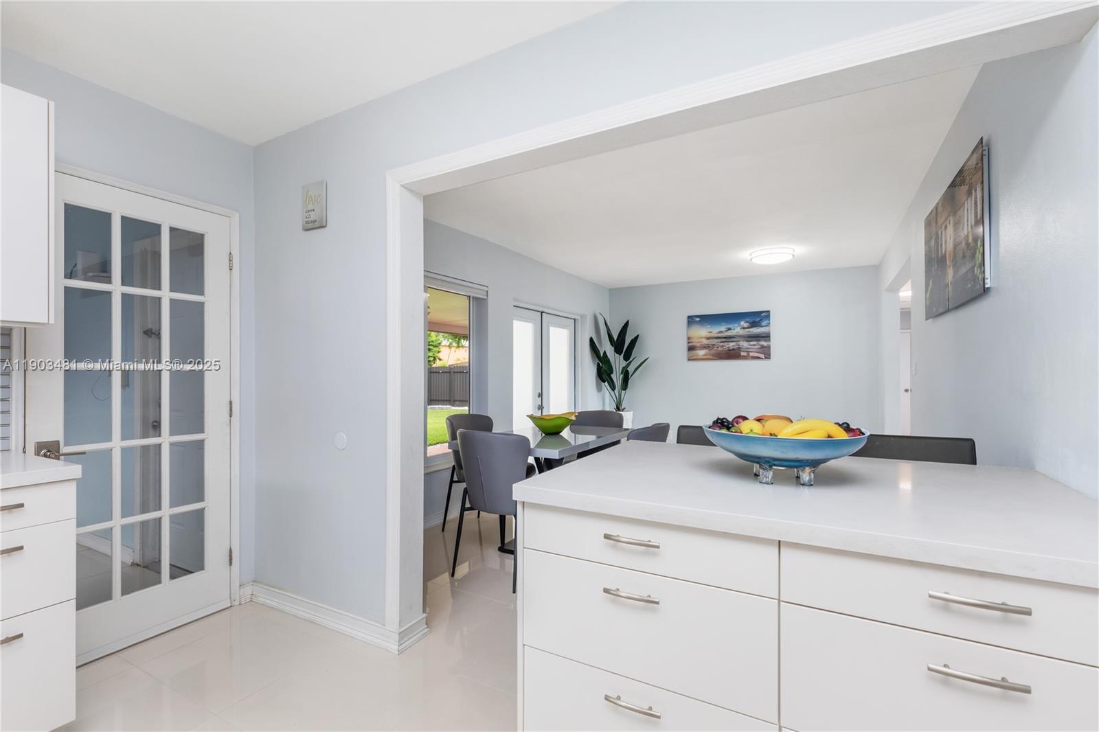 2670 Southwest 119th Court Miami, FL 33175 - Photo 15 of 39 a view of a kitchen and living room