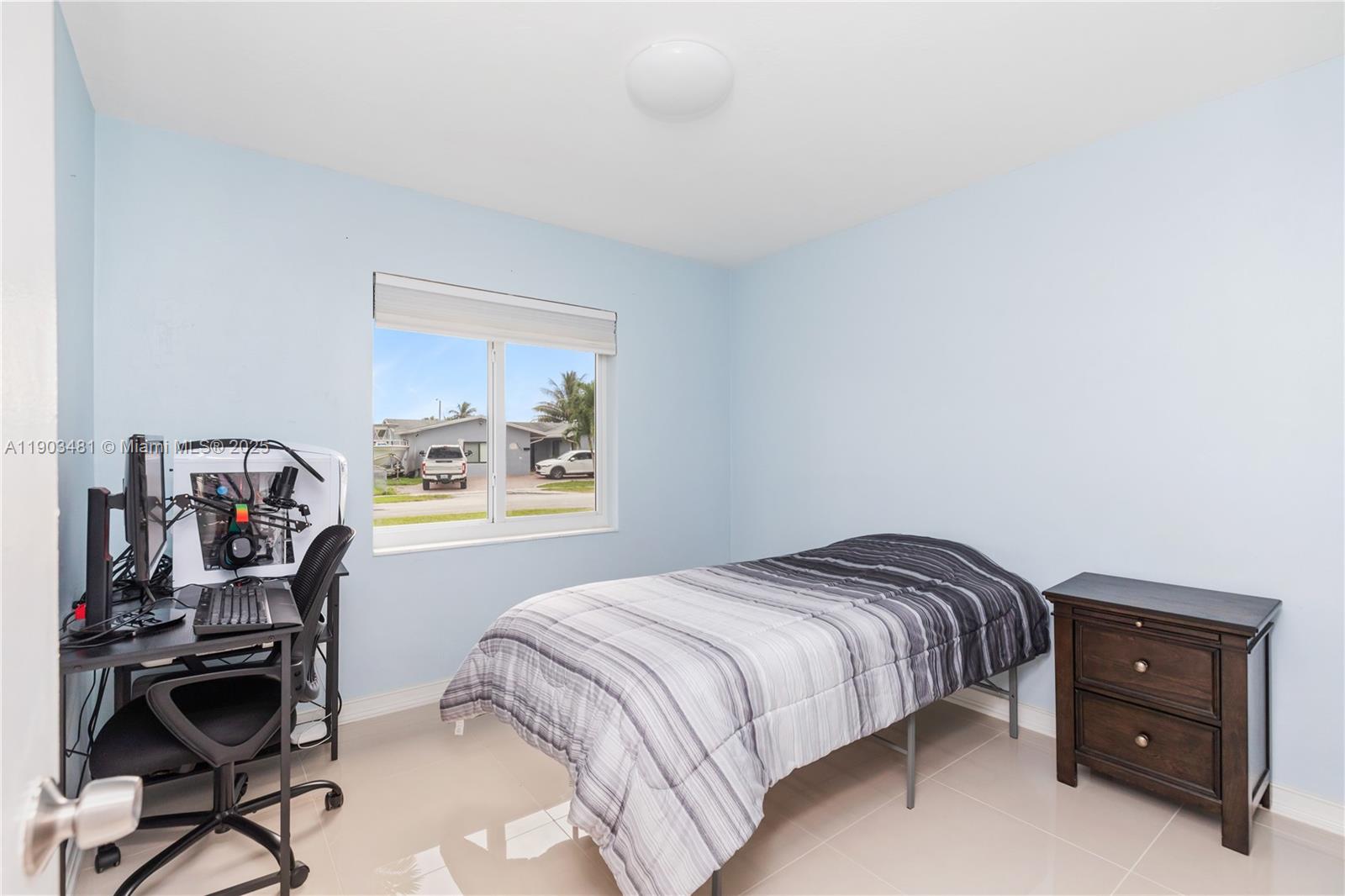 2670 Southwest 119th Court Miami, FL 33175 - Photo 21 of 39 a bedroom with a bed and a dresser