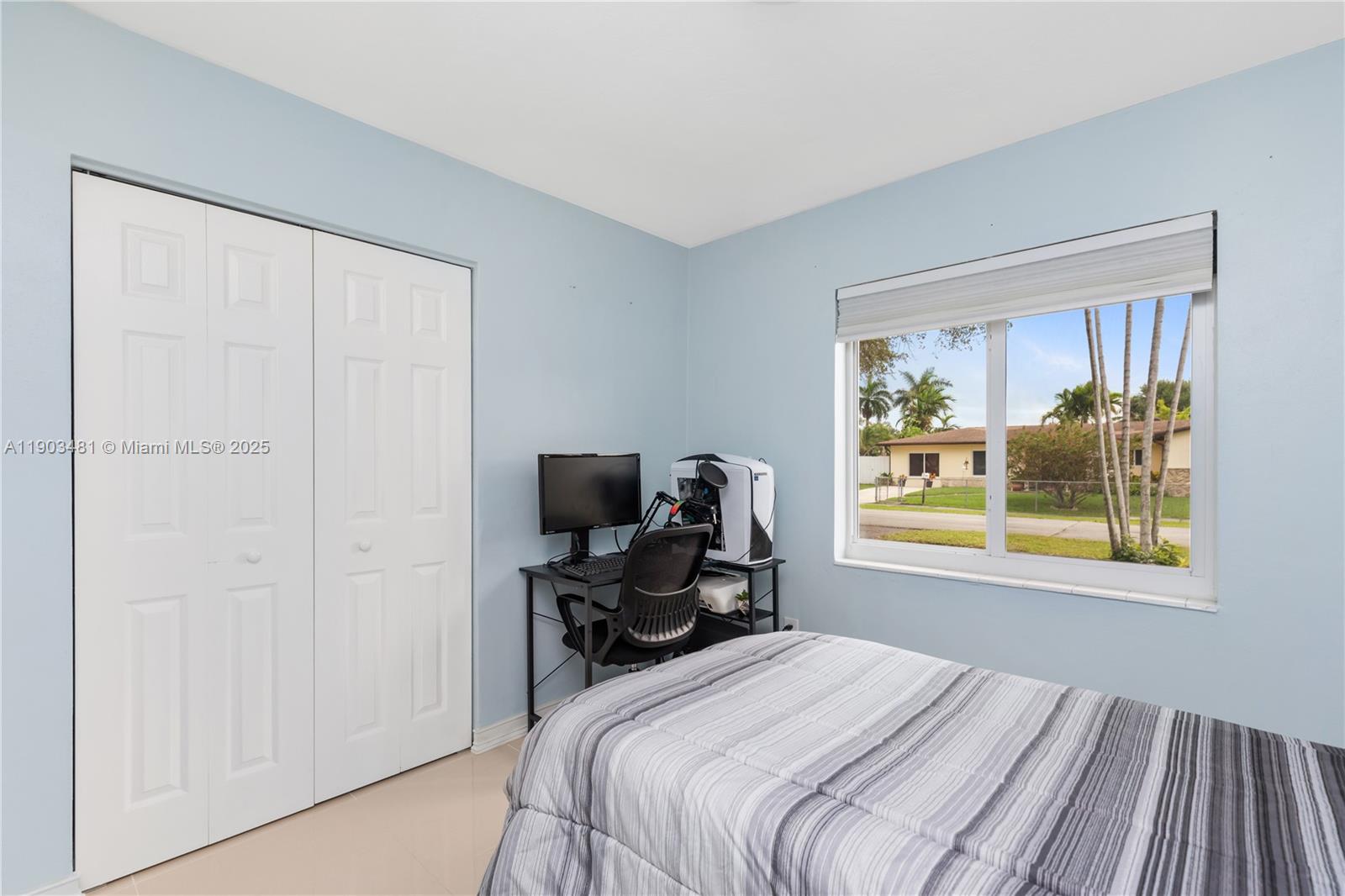 2670 Southwest 119th Court Miami, FL 33175 - Photo 22 of 39 a bedroom with a bed and a window