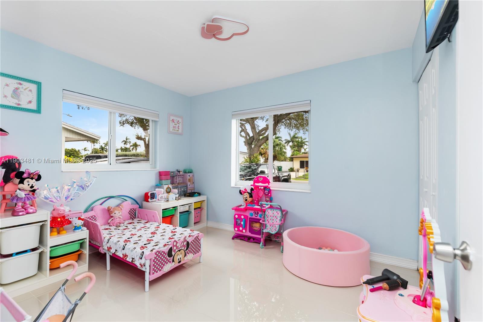 2670 Southwest 119th Court Miami, FL 33175 - Photo 25 of 39 a bedroom with baby bed a couch and a window