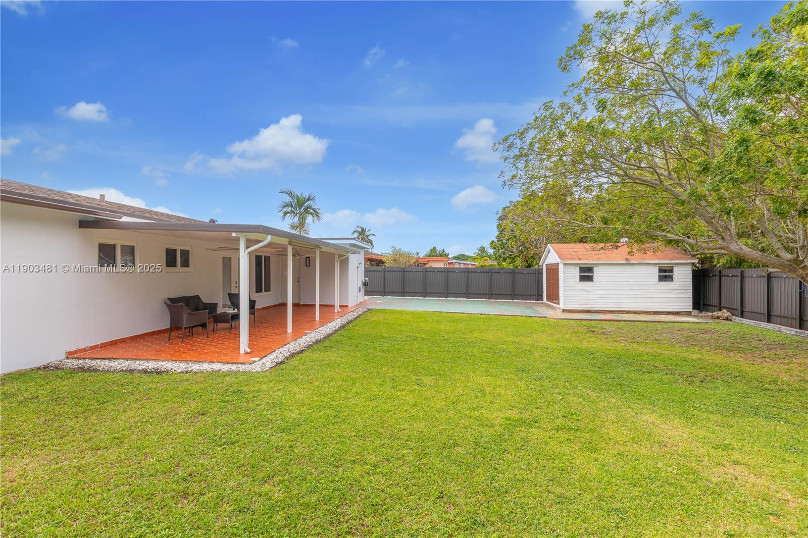 2670 Southwest 119th Court Miami, FL 33175 - Photo 37 of 39 a view of a house with pool and a yard