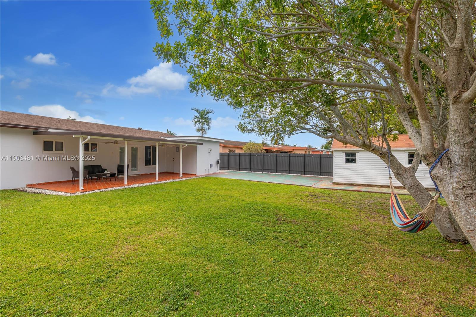 2670 Southwest 119th Court Miami, FL 33175 - Photo 39 of 39 a swimming pool with outdoor seating and yard