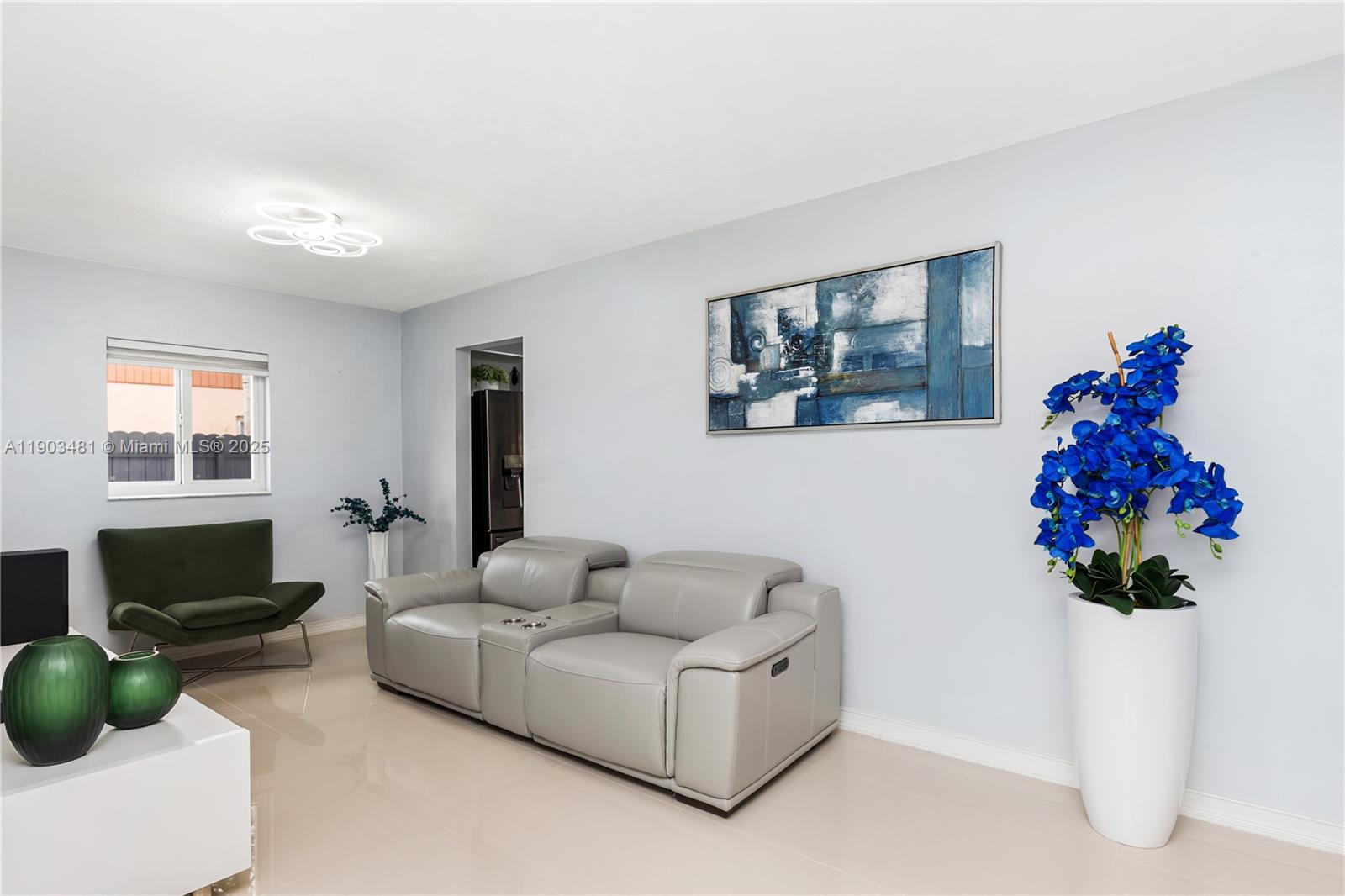 2670 Southwest 119th Court Miami, FL 33175 - Photo 5 of 39 a living room with furniture and a flat screen tv