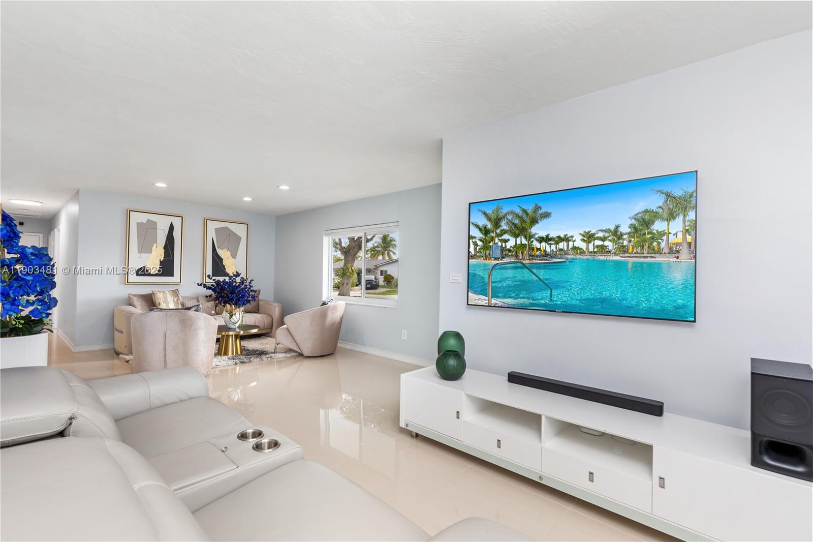 2670 Southwest 119th Court Miami, FL 33175 - Photo 6 of 39 a living room with furniture and a flat screen tv