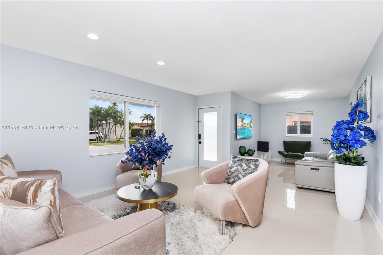 2670 Southwest 119th Court Miami, FL 33175 - Photo 9 of 39 a living room with furniture and flowers