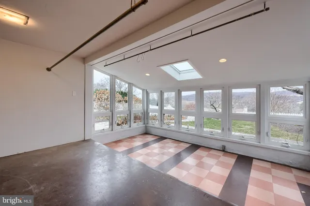 a view of a livingroom with wooden floor