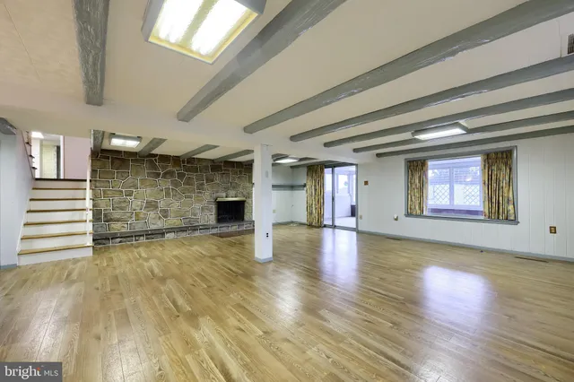a bathroom with a sink a toilet and a shower