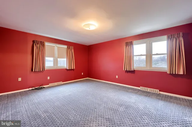 a view of room with racks on the wall