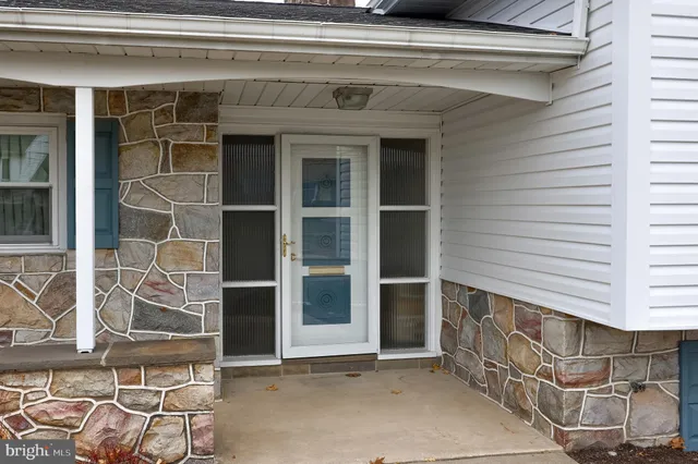 a kitchen with granite countertop a sink and cabinets