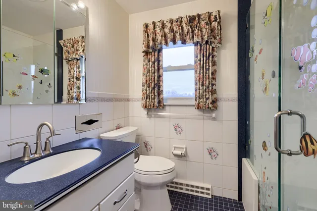 an aerial view of a house with outdoor space