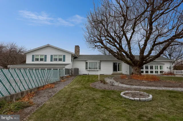 an aerial view of a house with outdoor space