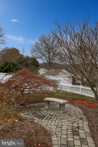an aerial view of a house with garden space and mountain view