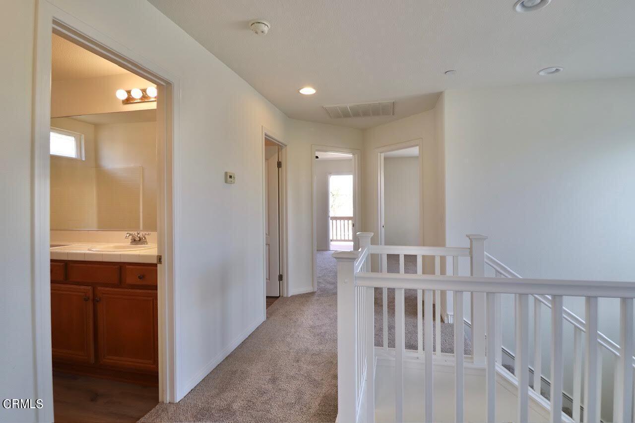 5200 Edgar Street Oxnard, CA 93033 - Photo 15 of 20 a view of hallway with a sink and a mirror
