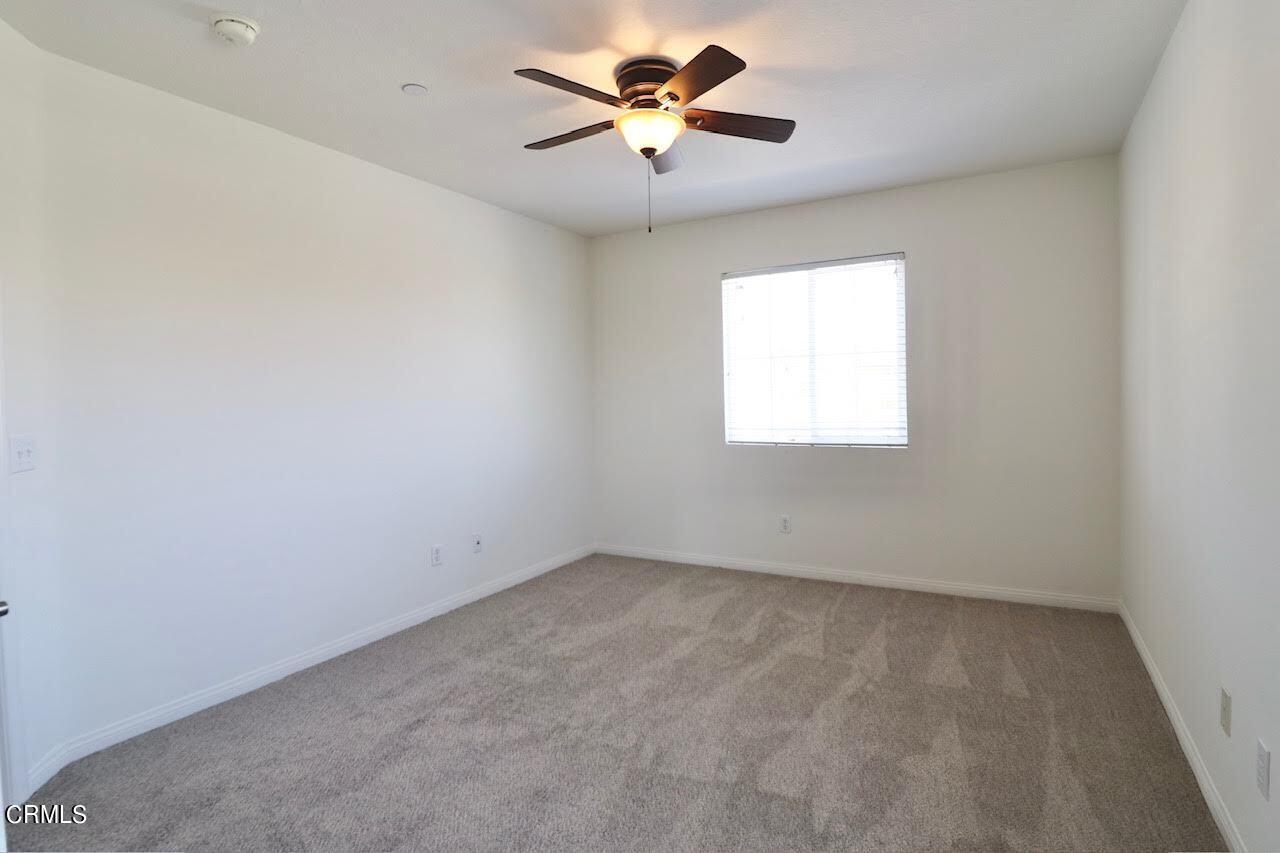 5200 Edgar Street Oxnard, CA 93033 - Photo 10 of 20 an empty room with a window and a ceiling fan