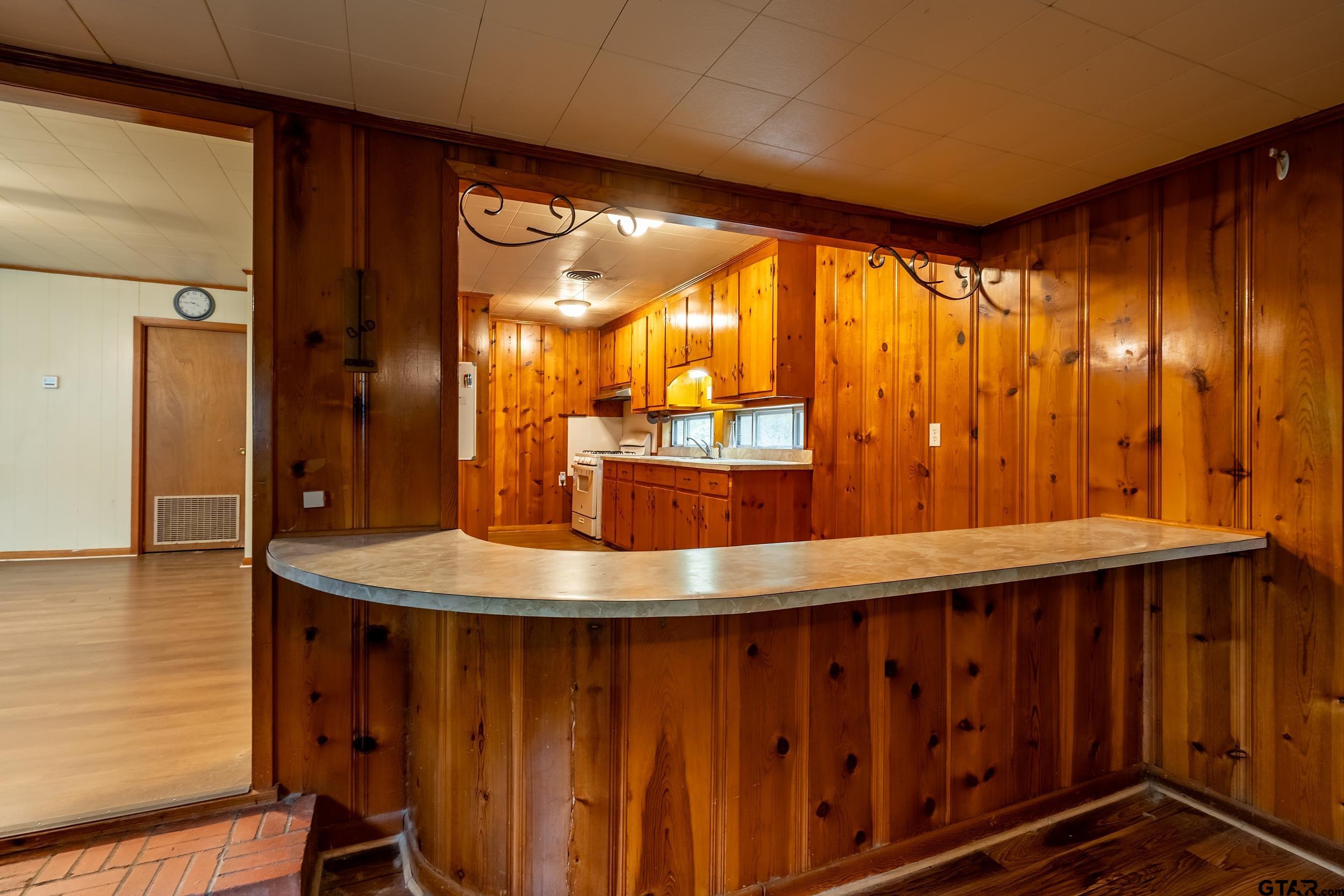 274 West Hill Street Rusk, TX 75785 - Photo 11 of 26 a room with wooden floor and large windows