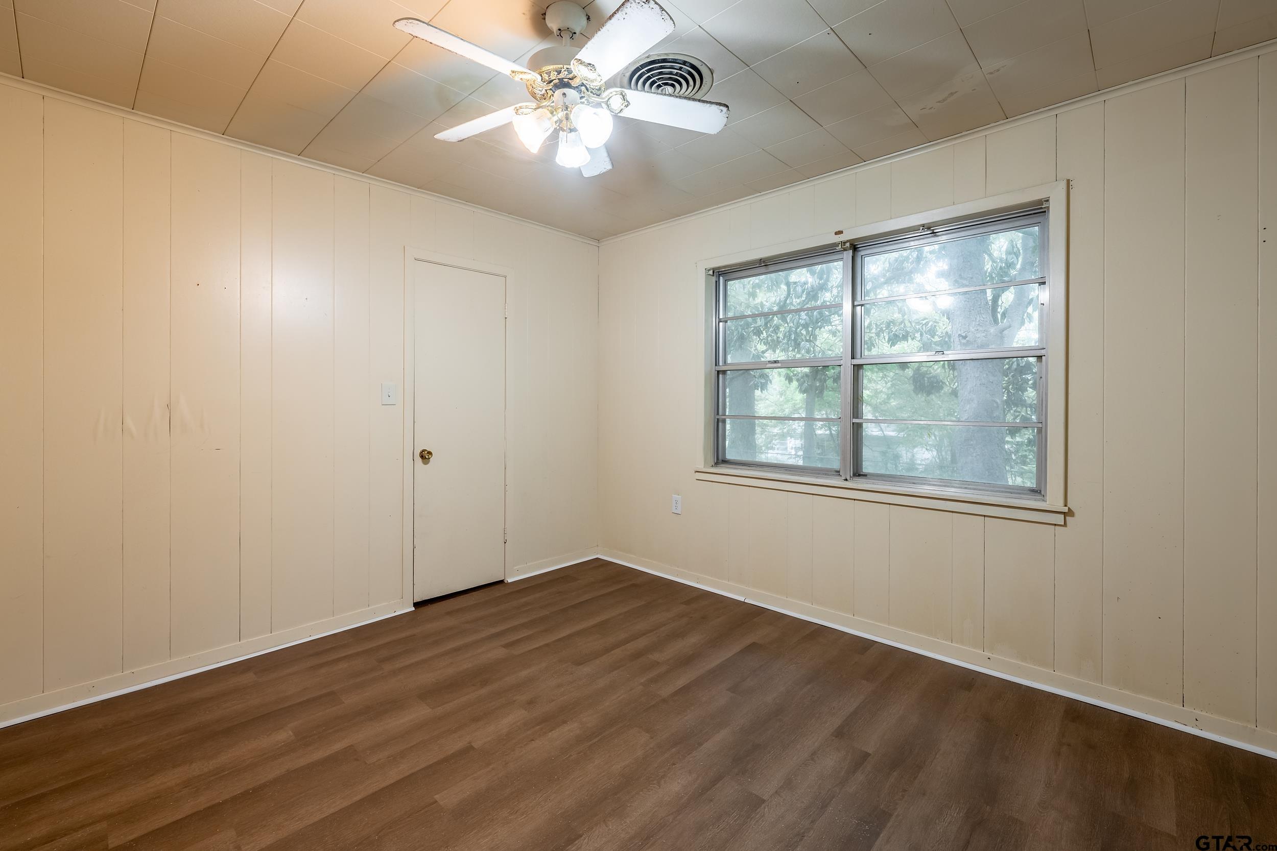 274 West Hill Street Rusk, TX 75785 - Photo 16 of 26 a view of empty room with wooden floor and fan