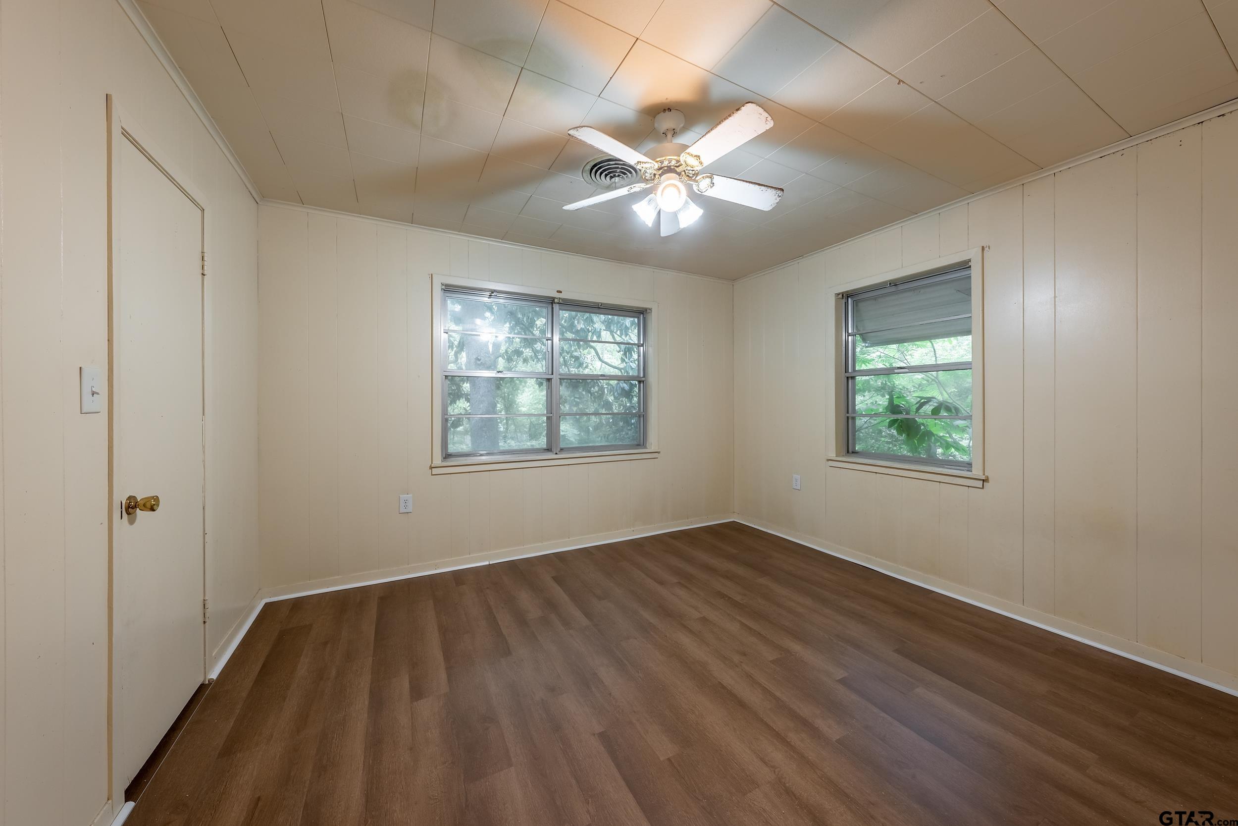 274 West Hill Street Rusk, TX 75785 - Photo 17 of 26 a view of an empty room with wooden floor and a window