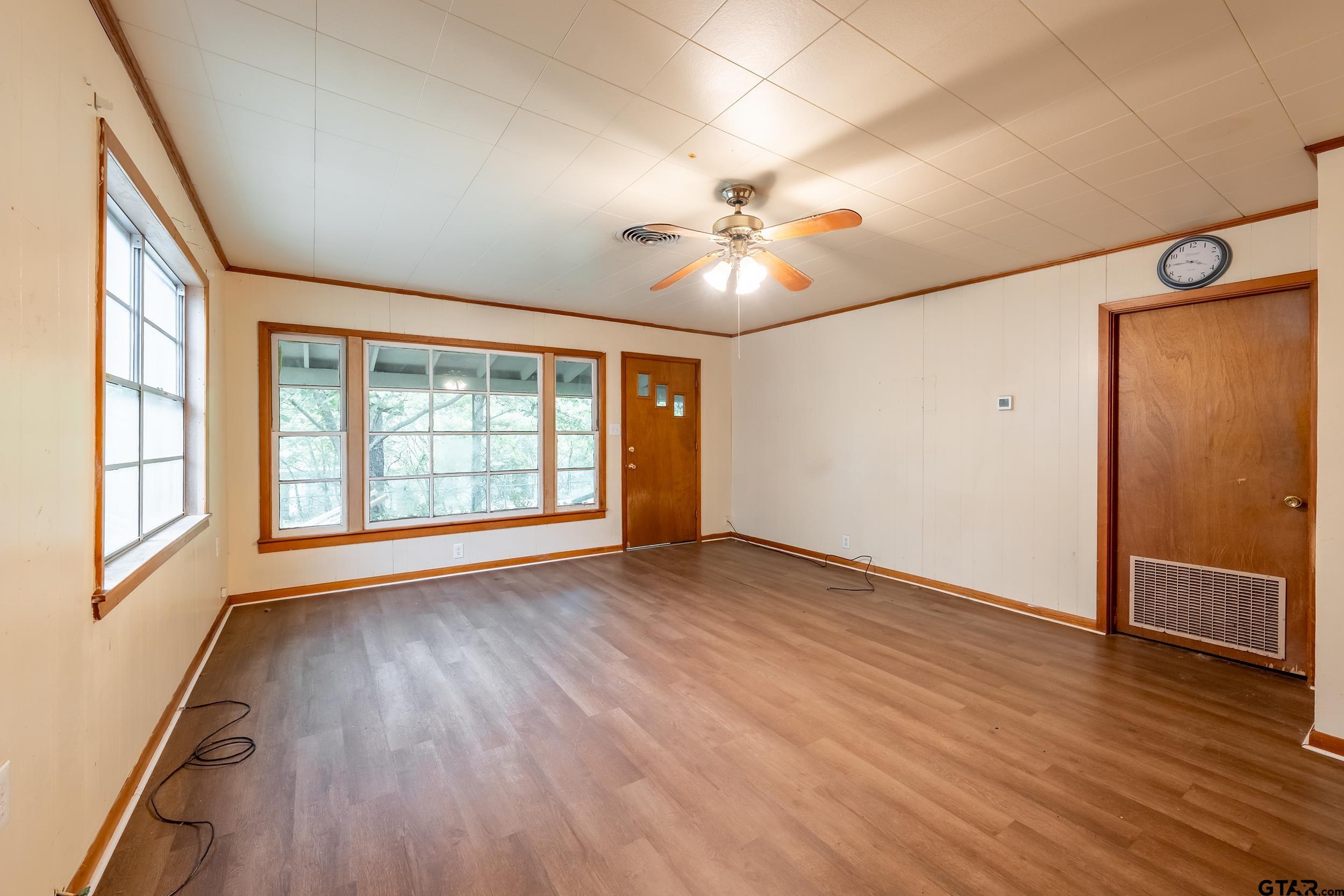 274 West Hill Street Rusk, TX 75785 - Photo 20 of 26 wooden floor in an empty room with a window