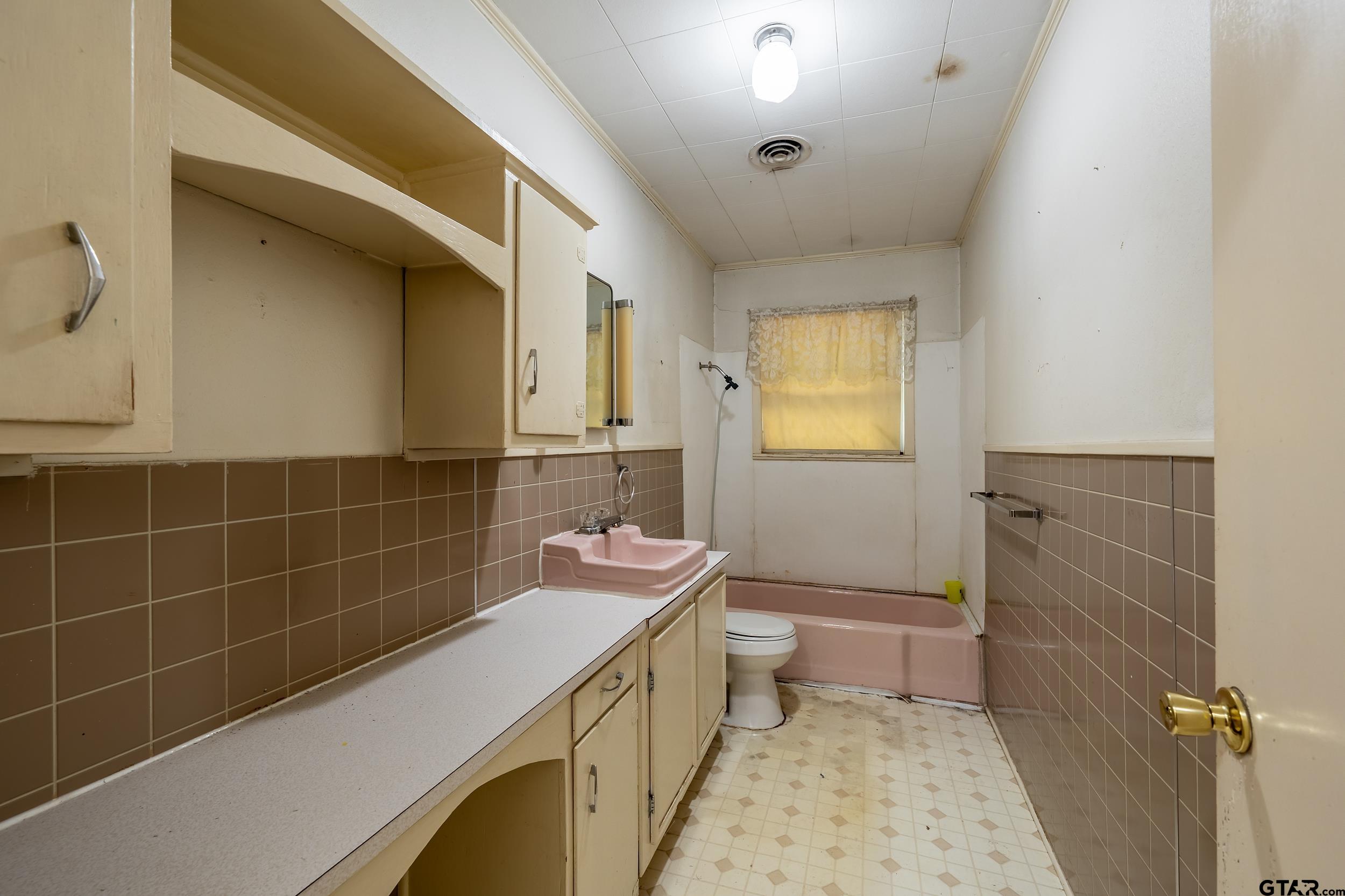 274 West Hill Street Rusk, TX 75785 - Photo 23 of 26 a bathroom with a sink a toilet and shower