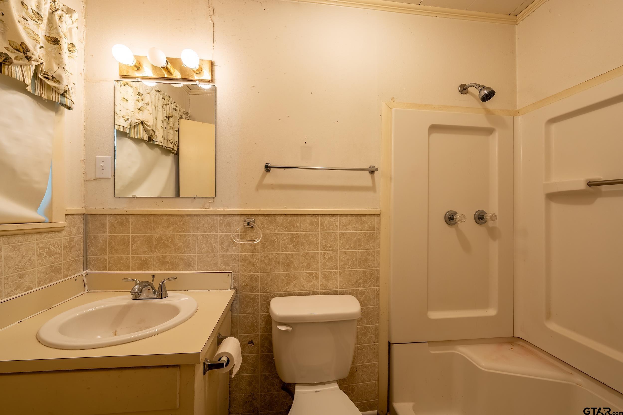 274 West Hill Street Rusk, TX 75785 - Photo 26 of 26 a bathroom with a sink a toilet and shower