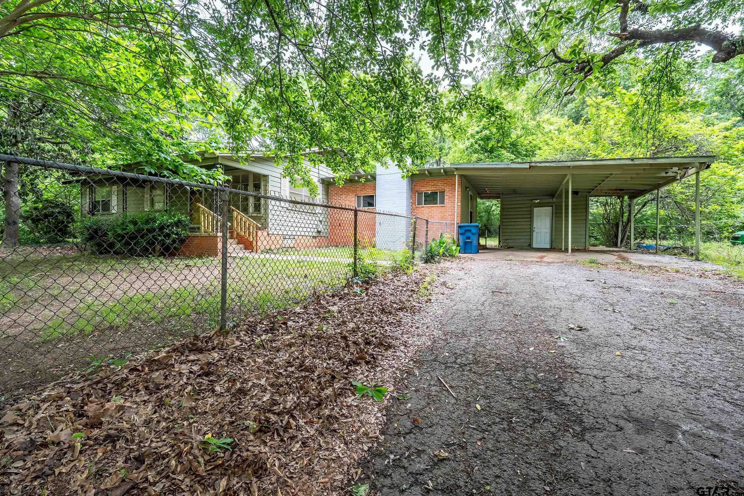 274 West Hill Street Rusk, TX 75785 - Photo 7 of 26 a view of a house with a backyard and a tree