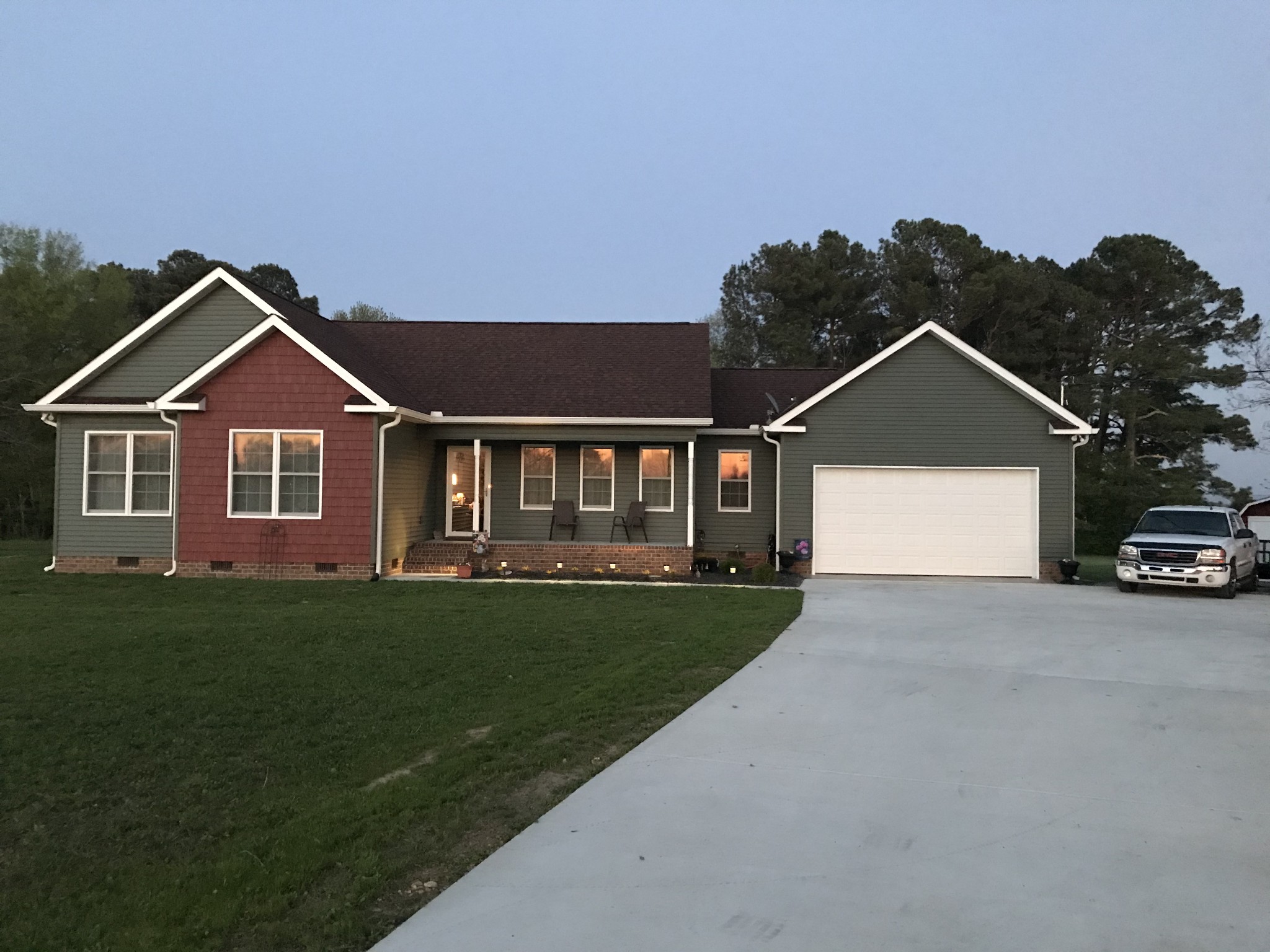 8284 Fredonia Road Manchester, TN 37355 - Photo 1 of 25 a front view of a house with a yard and garage