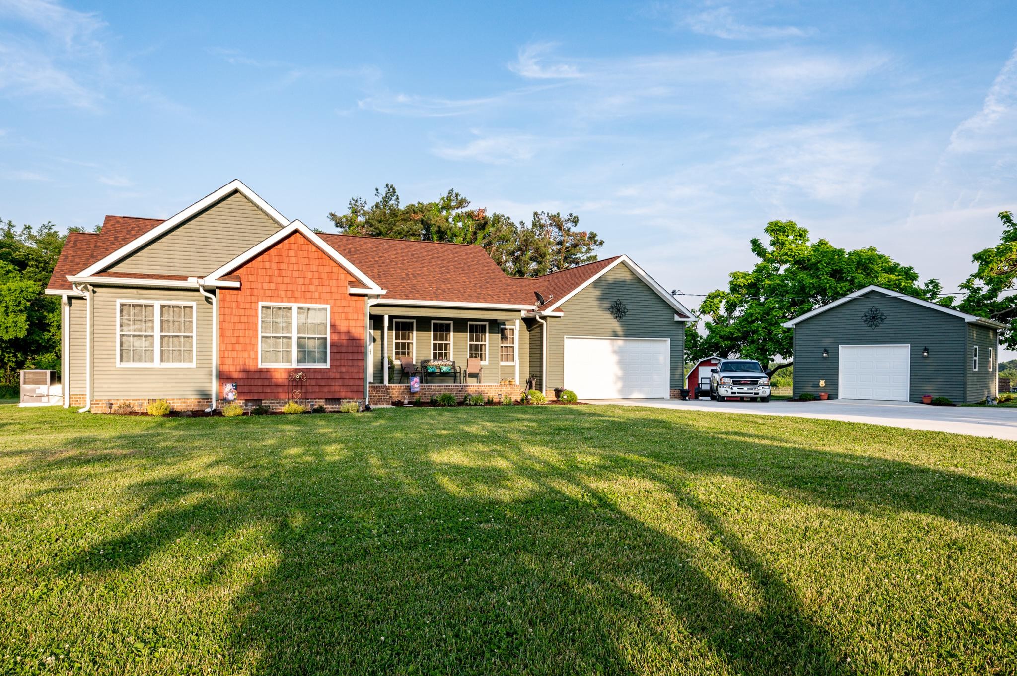 8284 Fredonia Road Manchester, TN 37355 - Photo 2 of 25 a front view of a house with a yard and trees