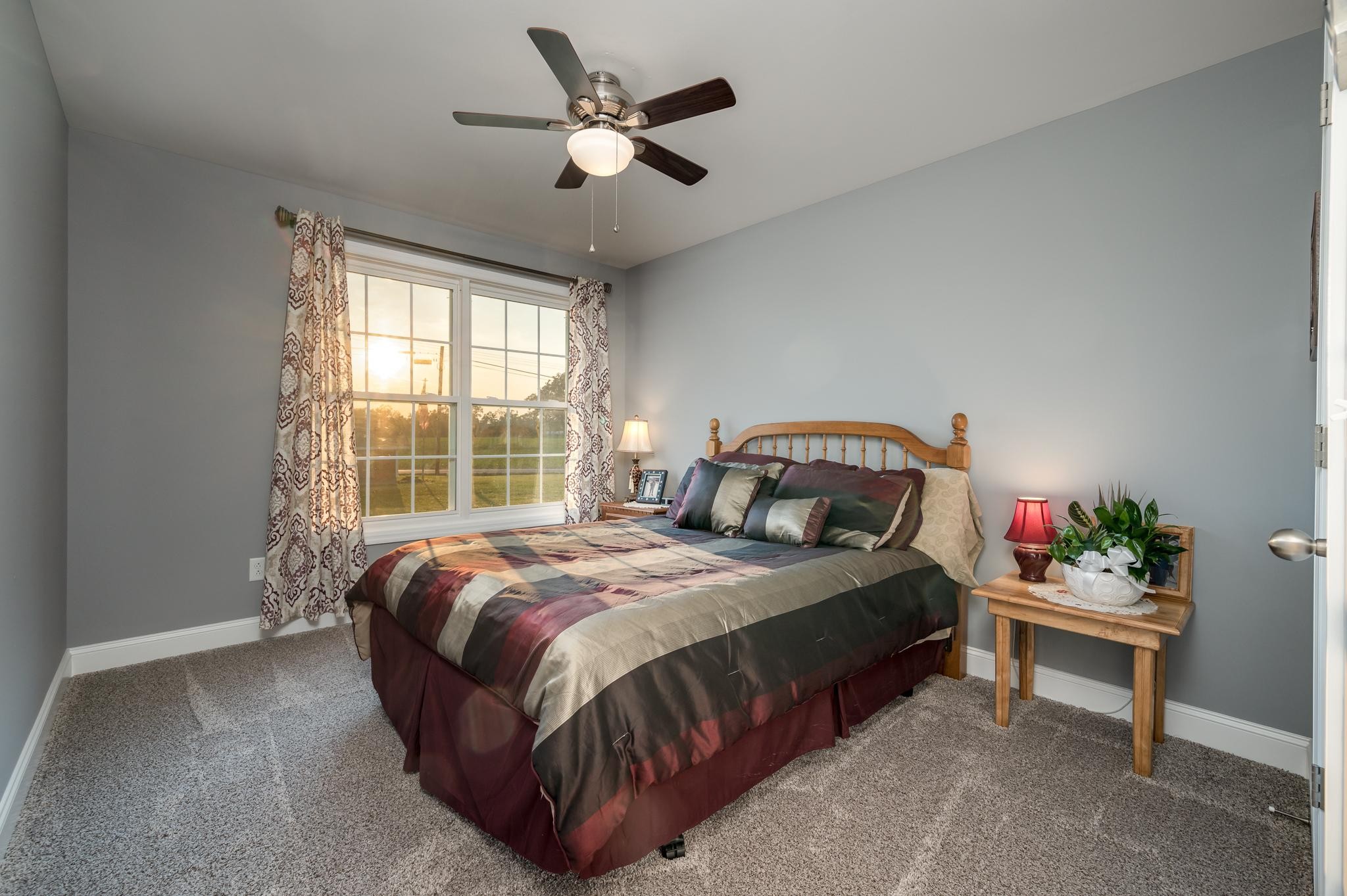 8284 Fredonia Road Manchester, TN 37355 - Photo 12 of 25 a bedroom with a bed and a chandelier