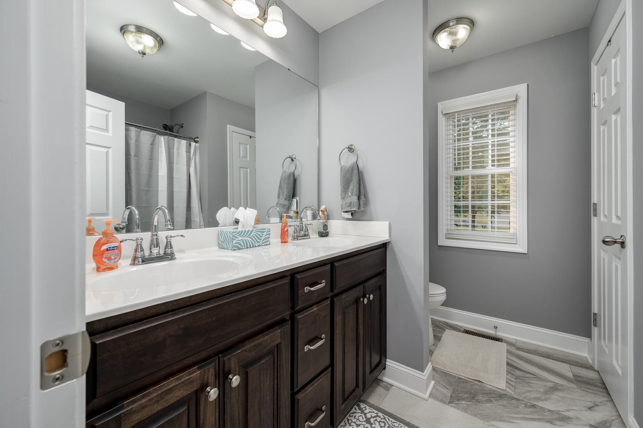 8284 Fredonia Road Manchester, TN 37355 - Photo 15 of 25 a bathroom with a sink double vanity and a mirror