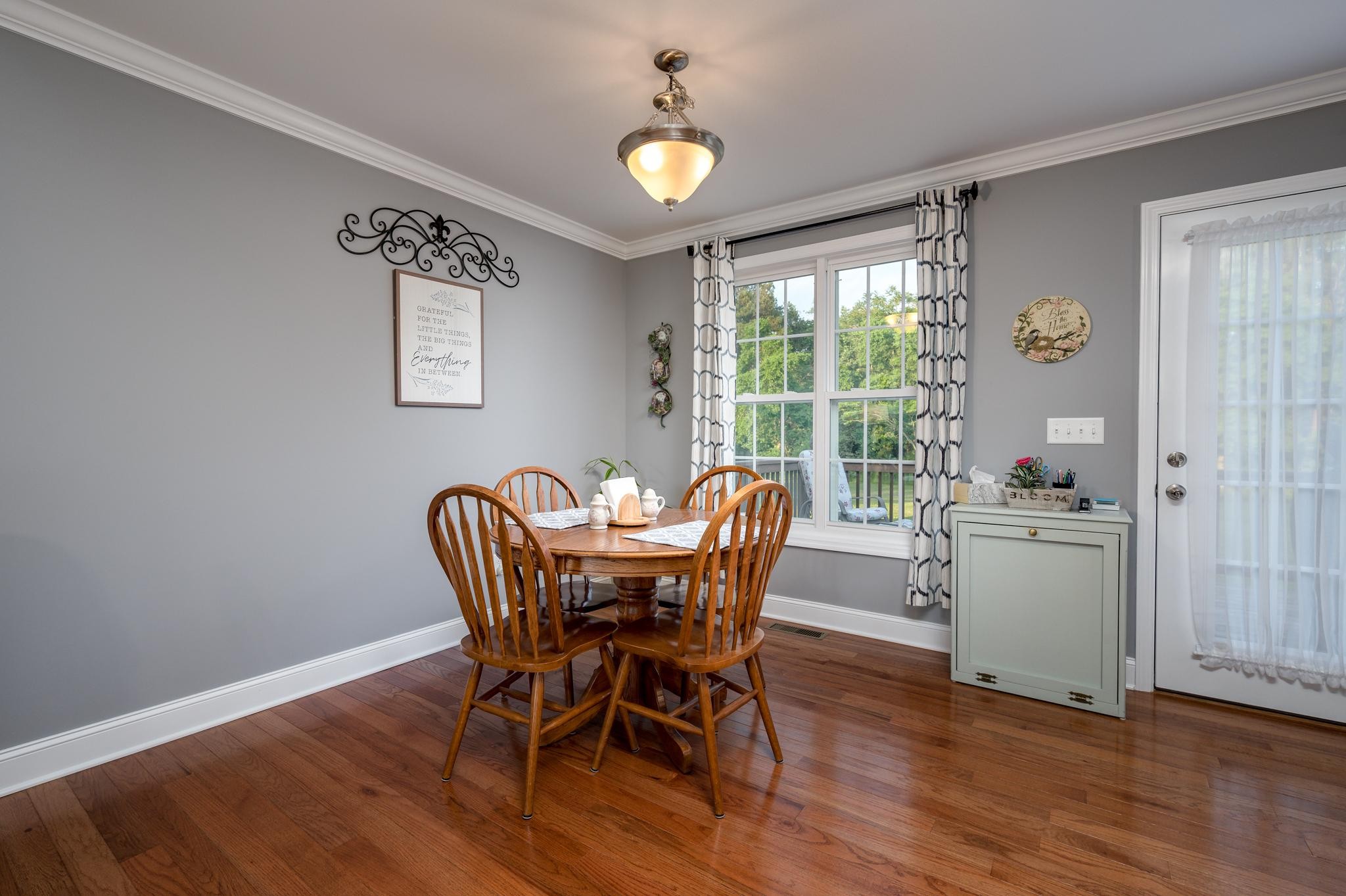 8284 Fredonia Road Manchester, TN 37355 - Photo 7 of 25 a dining room with furniture a window and wooden floor