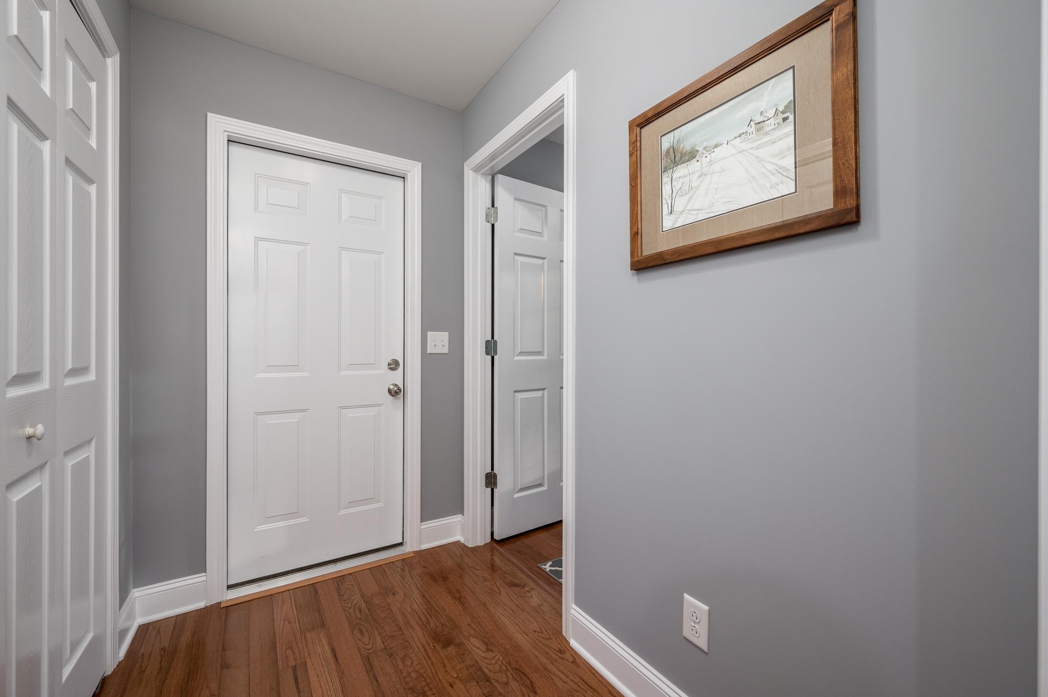 8284 Fredonia Road Manchester, TN 37355 - Photo 9 of 25 a view of a hallway with wooden floor and closet