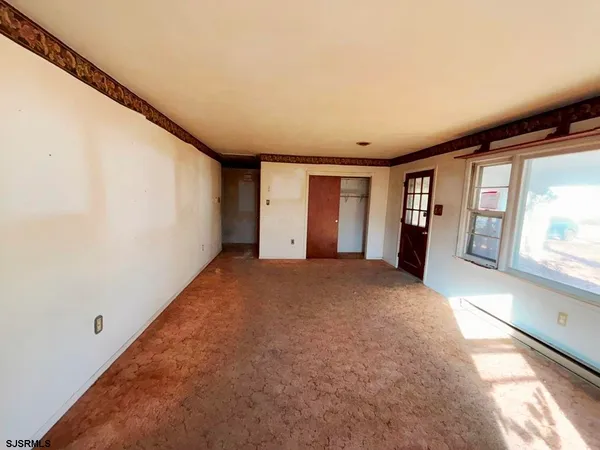 a view of empty room with windows