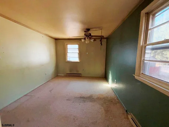 an empty room with windows