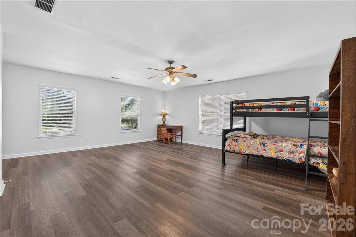 8006 Fine Robe Drive Indian Trail, NC 28079 - Photo 29 of 36 a living room with furniture and a wooden floor