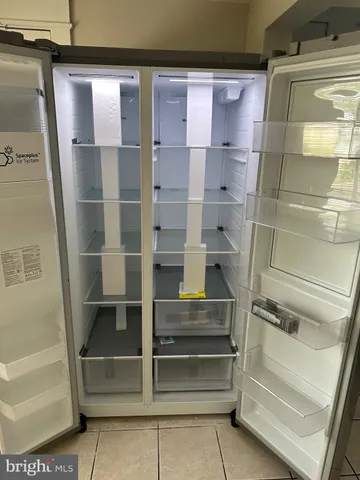 a bathroom with a wooden floor and a toilet