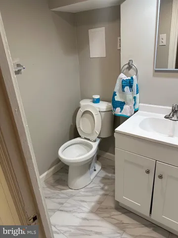 a bathroom with a sink and mirror