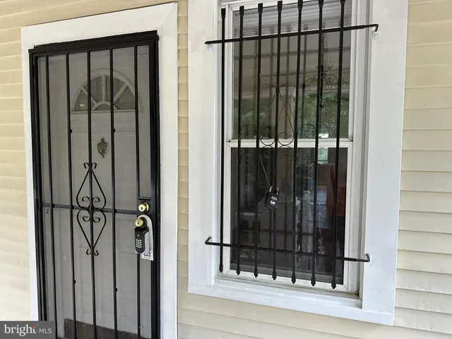 a kitchen with a sink cabinets appliances and a window