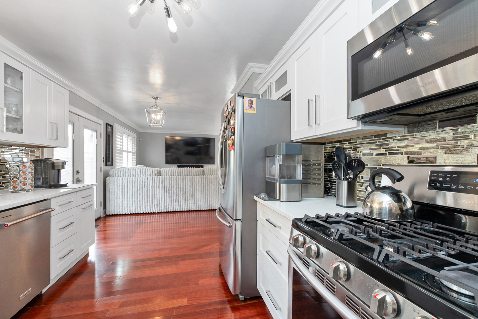 13 Oakview Road Matteson, IL 60443 - Photo 7 of 23 a kitchen with stainless steel appliances granite countertop a stove and a refrigerator