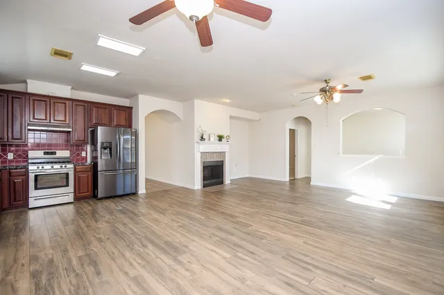 a view of kitchen with sink microwave and stove