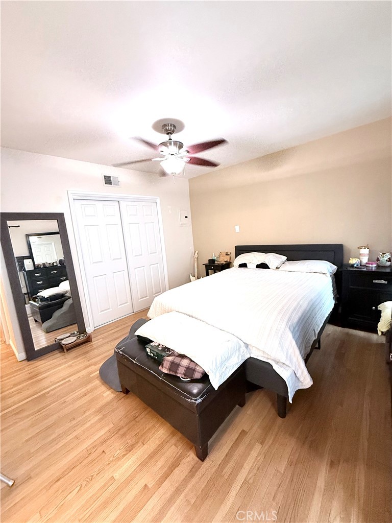 970 West 8th Street San Pedro, CA 90731 - Photo 14 of 22 a bedroom with a bed and a mirror