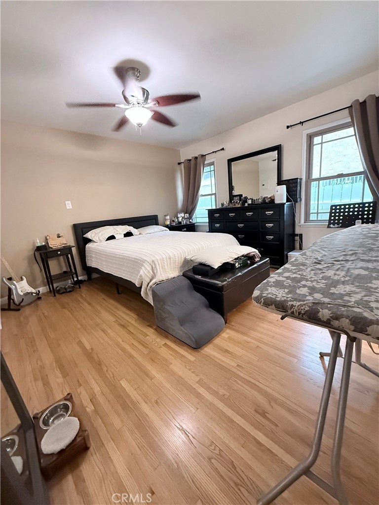 970 West 8th Street San Pedro, CA 90731 - Photo 15 of 22 a bedroom with a bed and wooden floor