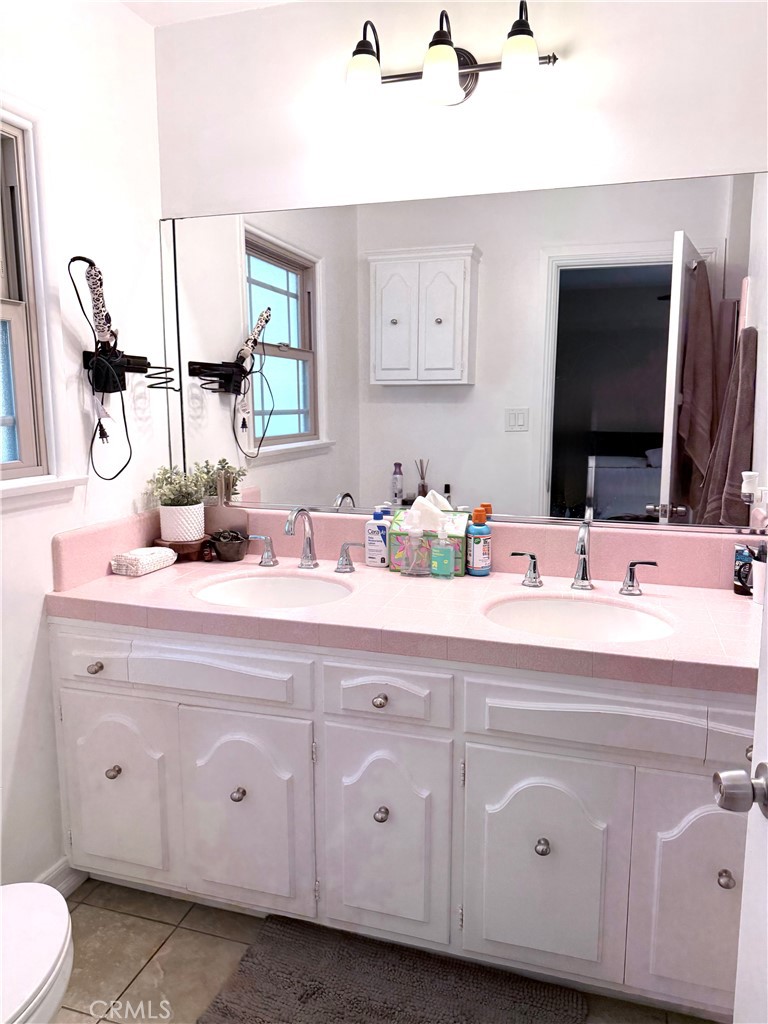970 West 8th Street San Pedro, CA 90731 - Photo 16 of 22 a bathroom with a double vanity sink and mirror