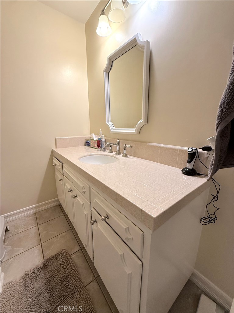 970 West 8th Street San Pedro, CA 90731 - Photo 17 of 22 a bathroom with a sink vanity and a mirror