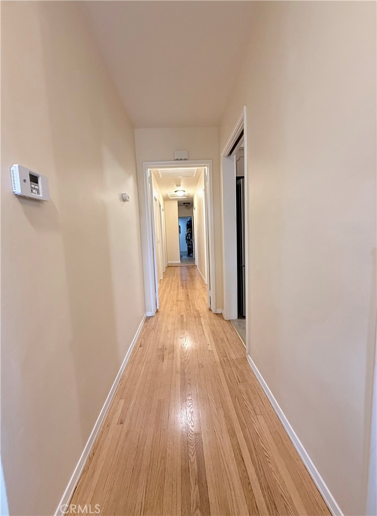 970 West 8th Street San Pedro, CA 90731 - Photo 19 of 22 a view of a hallway with wooden floor