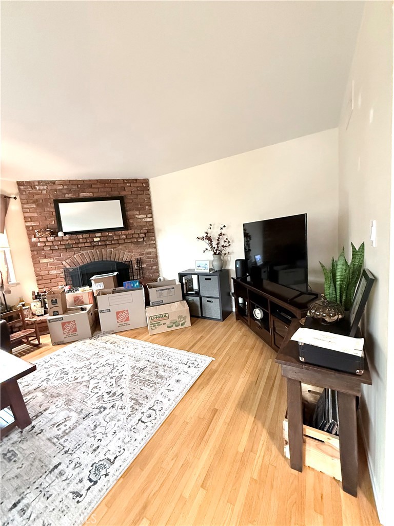 970 West 8th Street San Pedro, CA 90731 - Photo 8 of 22 a bedroom with a bed and a flat screen tv