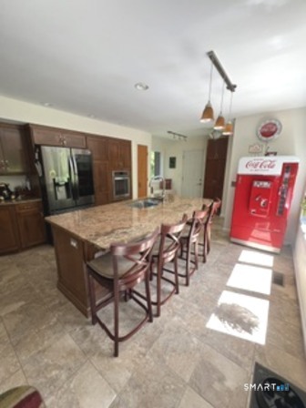 72 Pinnacle Road Ellington, CT 06029 - Photo 7 of 38 a view of a dining room with furniture