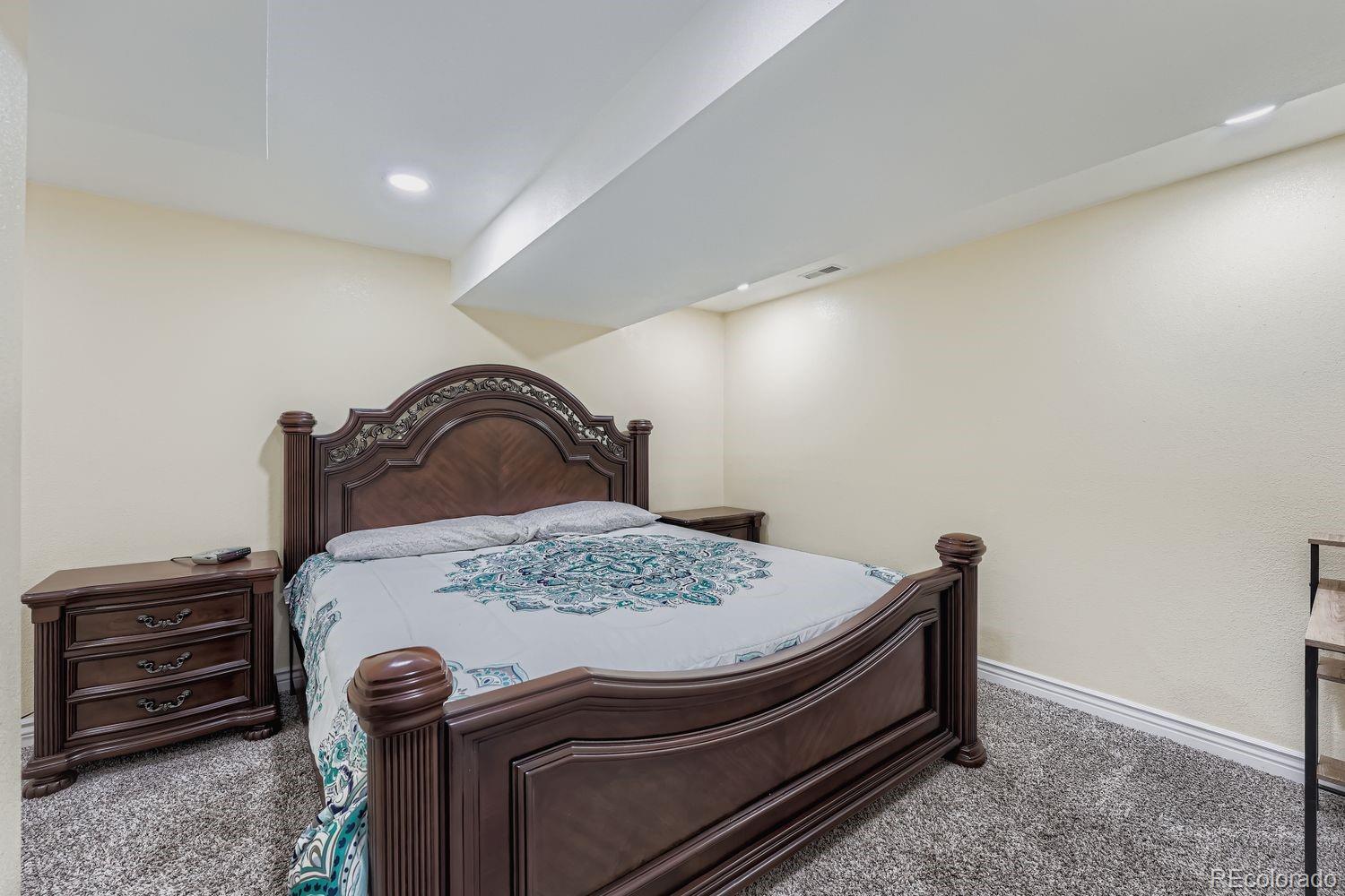 361 East Thomas Avenue Byers, CO 80103 - Photo 24 of 28 a bedroom with a bed and dresser