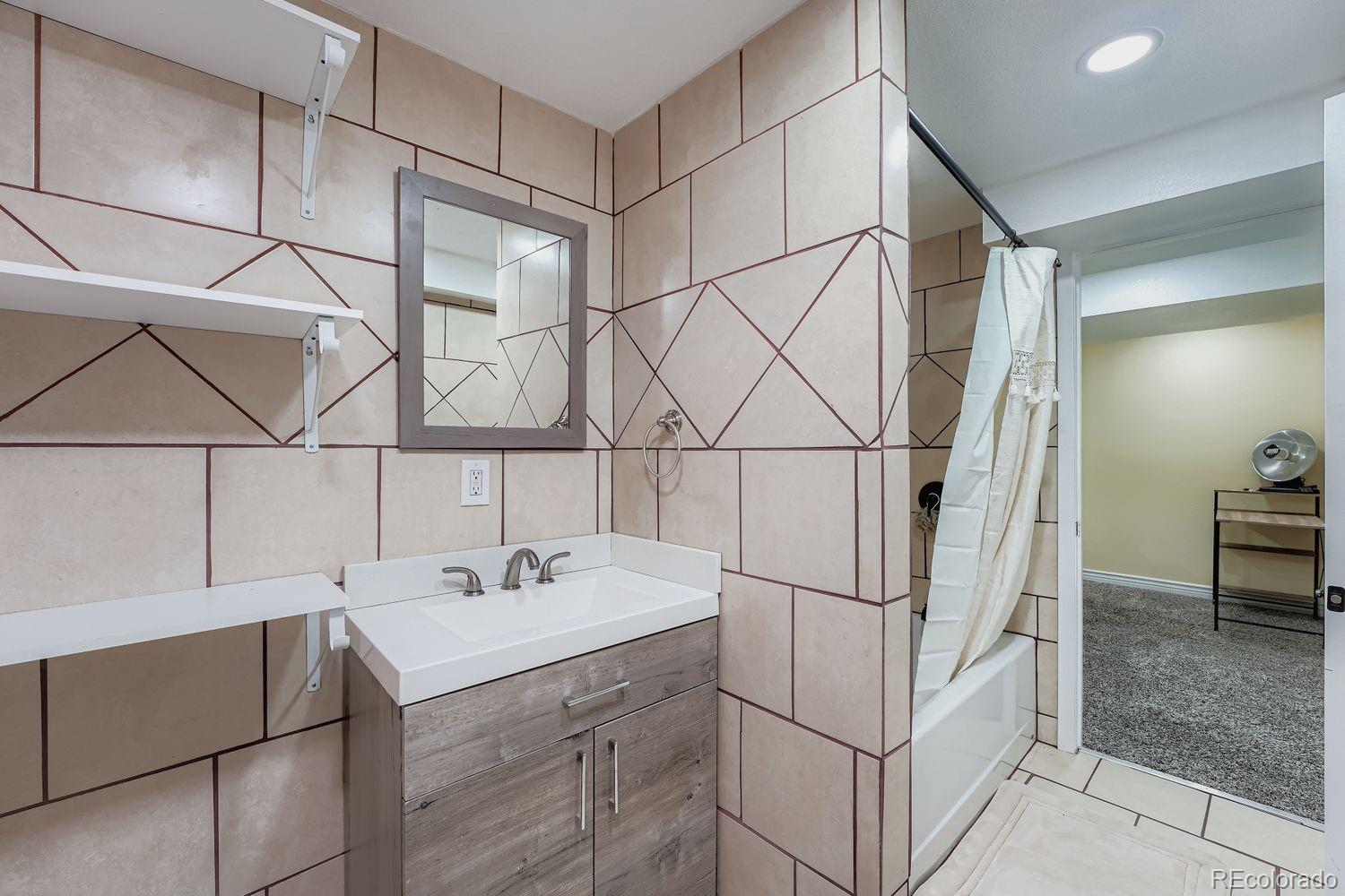 361 East Thomas Avenue Byers, CO 80103 - Photo 25 of 28 a utility room with a sink and cabinets