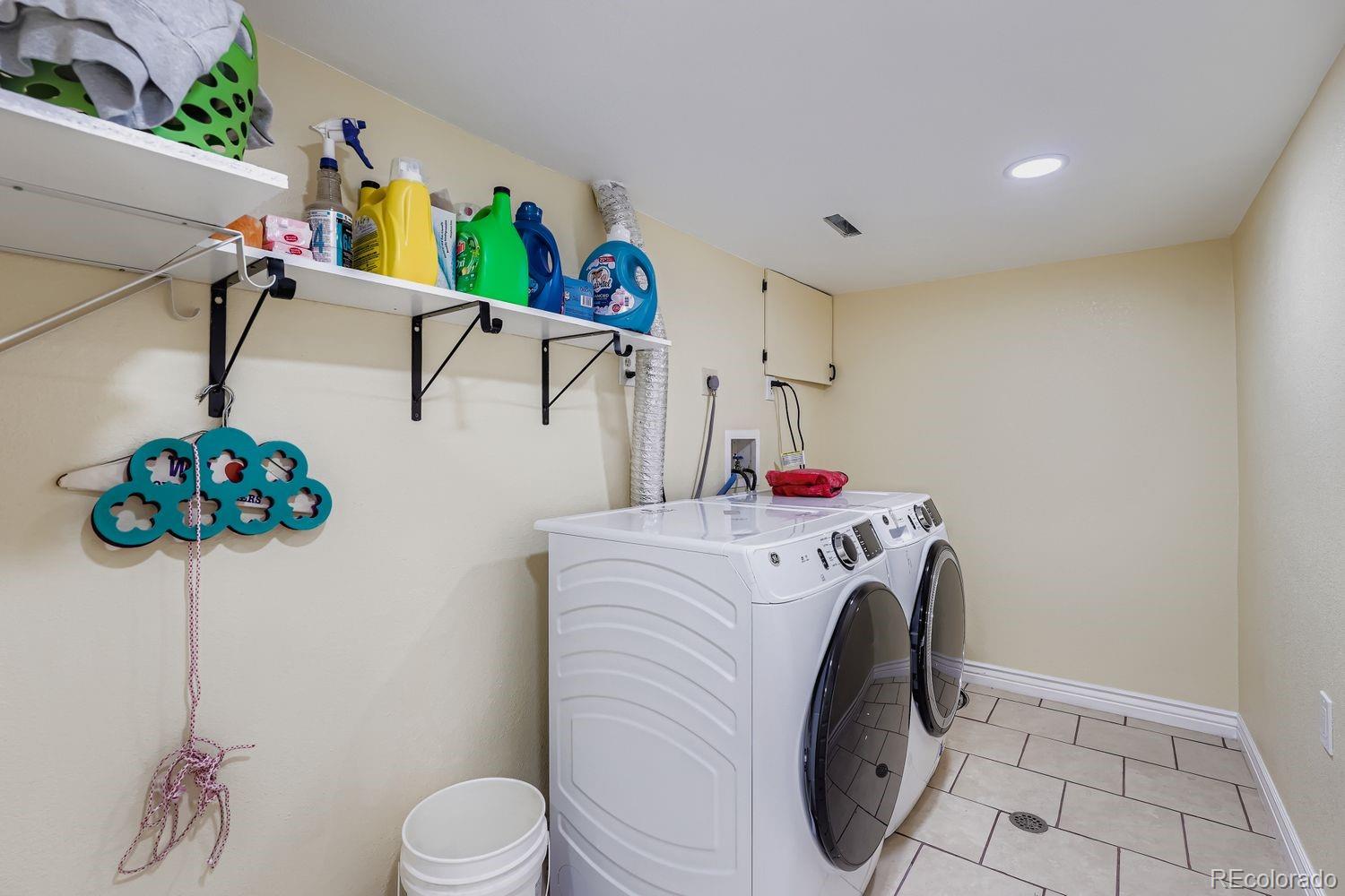 361 East Thomas Avenue Byers, CO 80103 - Photo 26 of 28 a utility room with dryer and washer