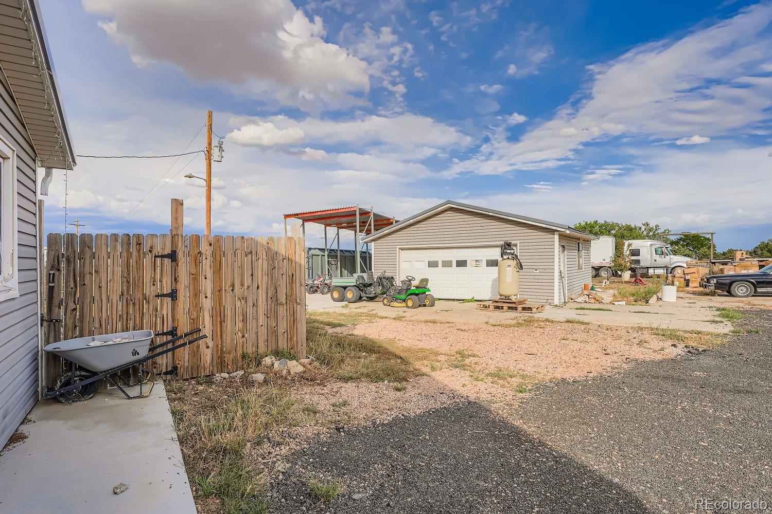 361 East Thomas Avenue Byers, CO 80103 - Photo 27 of 28 a view of a house with a yard